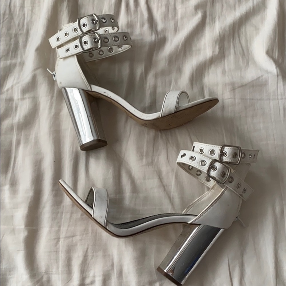 White and silver buckle heels